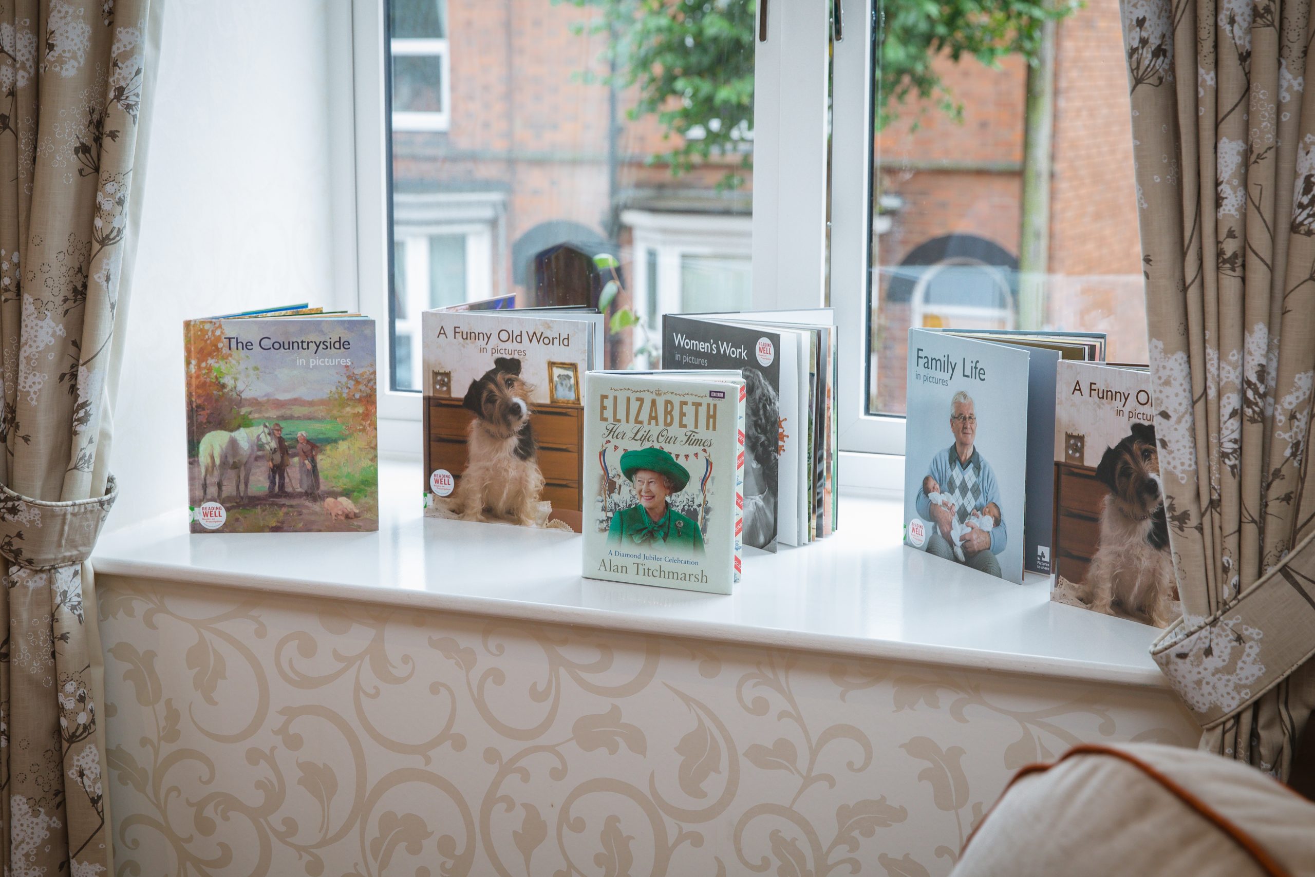 A selection of books for residents to read on the windowsill