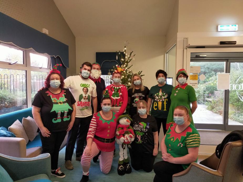 staff dressed up as elves for christmas