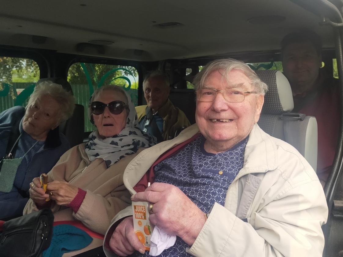 residents in minibus preparing for a day trip