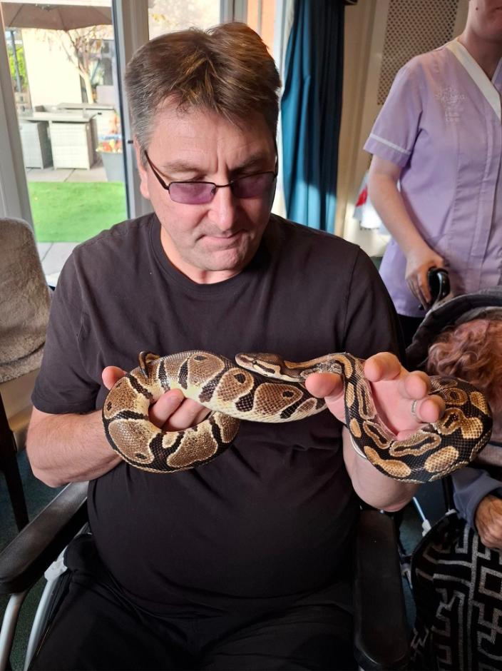 Resident with a snake