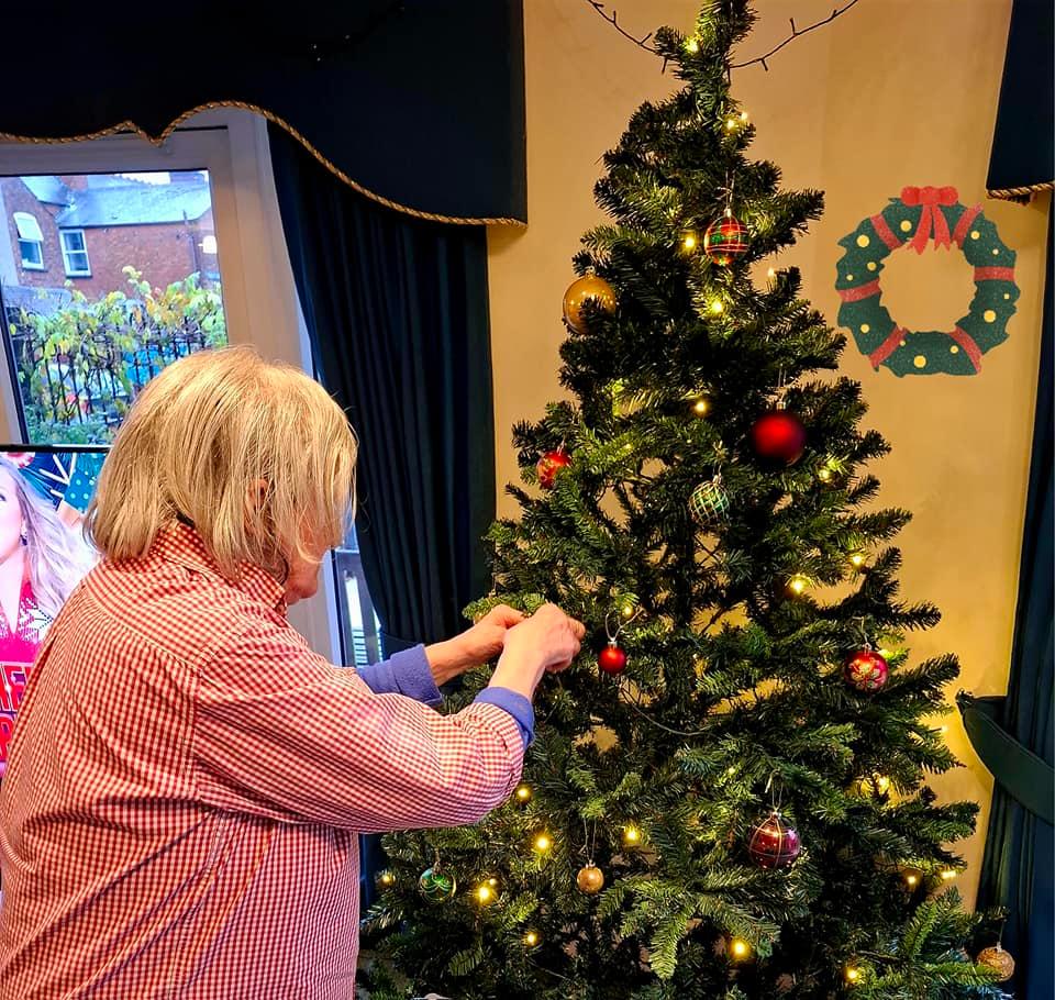 resident decorating tree