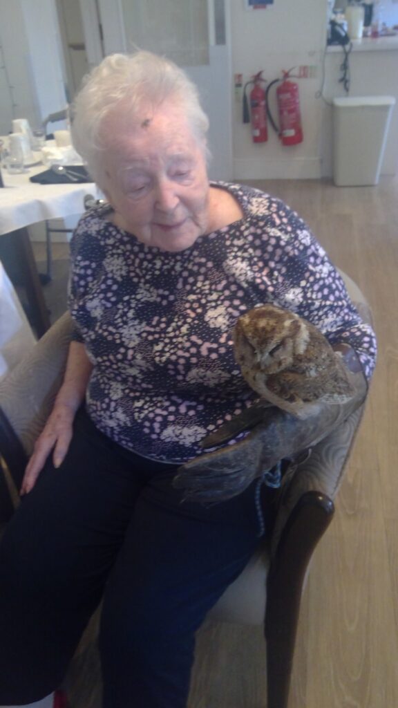 one of our female residents sat with an owl on her arm