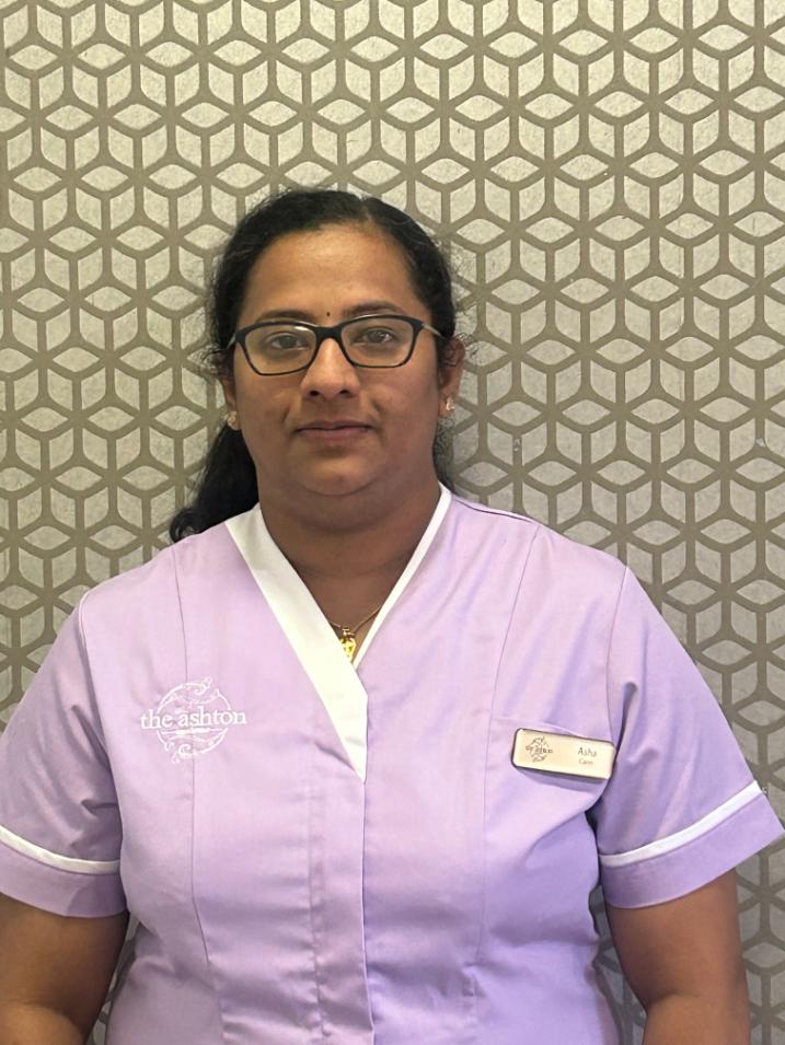 lady with glasses posing for staff photo