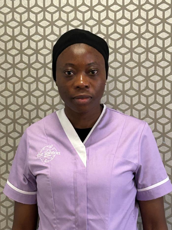 lady smiling at camera for staff photo