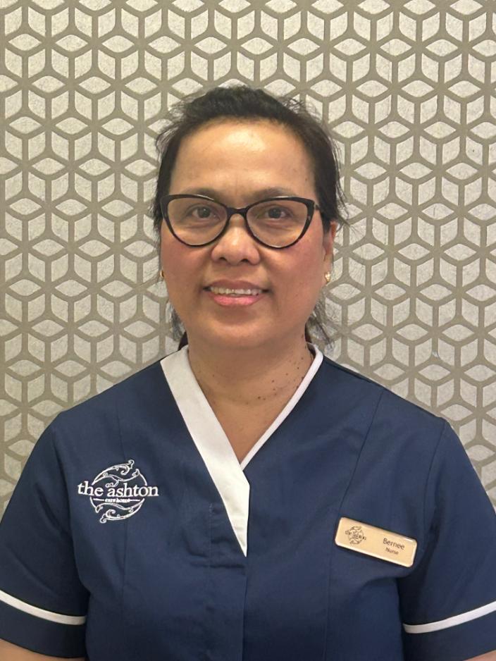 lady smiling at camera for staff photo