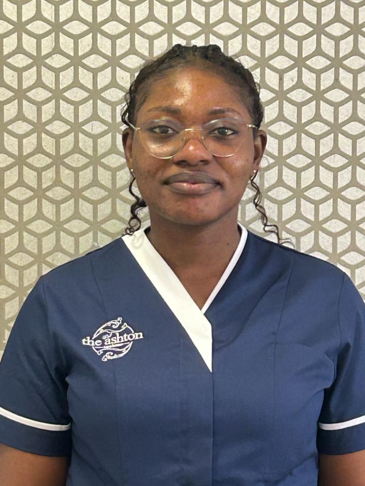 lady smiling at camera for staff photo