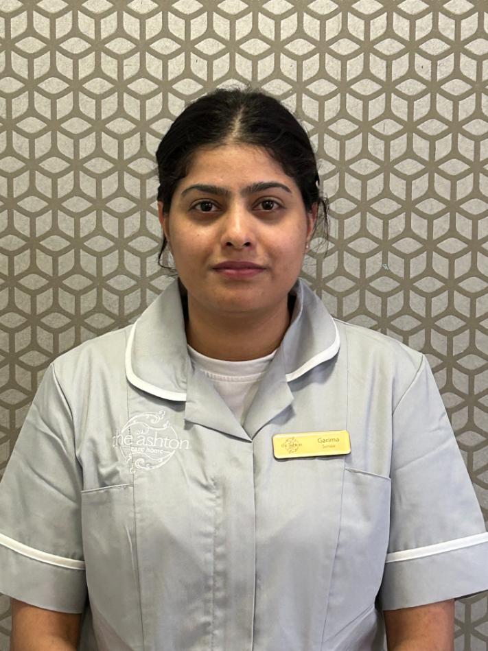 lady smiling at camera for staff photo
