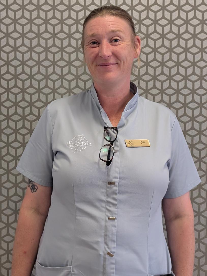 lady smiling at camera for staff photo