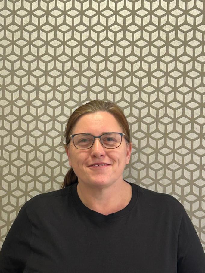 lady smiling at camera for staff photo