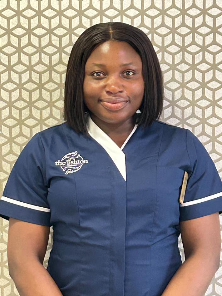 lady smiling at camera for staff photo
