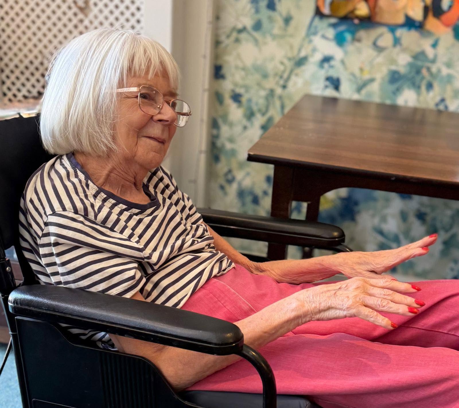 lady in a wheelchair smiling