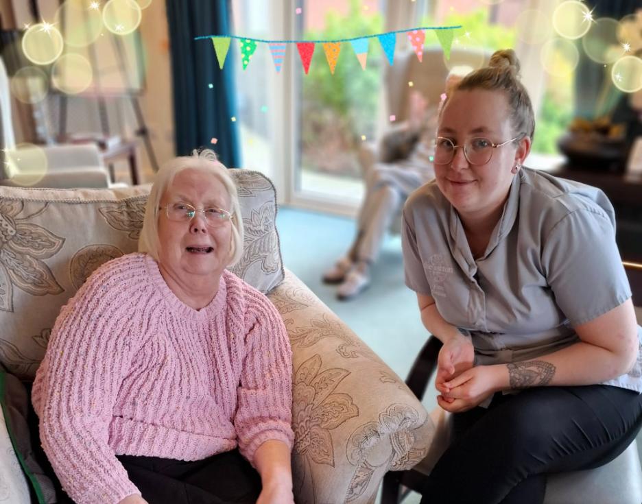 resident and carer smiling