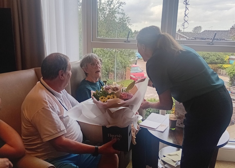 resident presented with bouquet