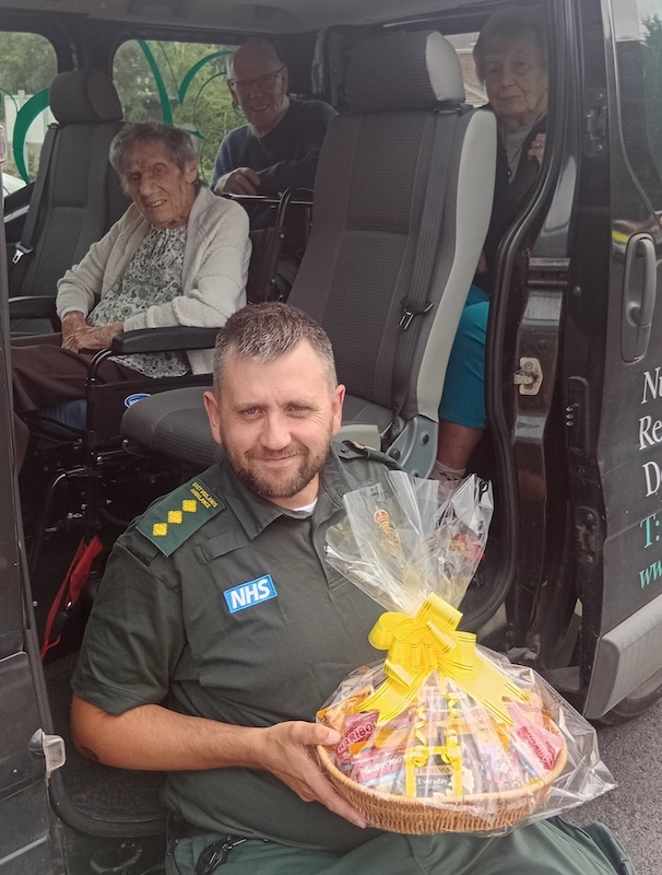 nhs worker and resident smiling